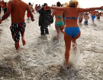 A group of people taking the polar plunge