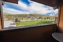 Balcony with covered window looking out at Granby, Colorado.